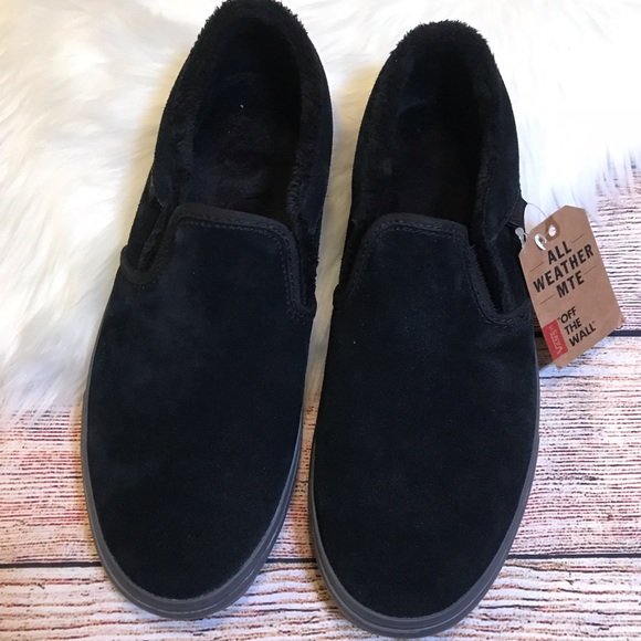 solid black vans slip on